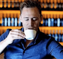 Tom Hiddleston Sips Tea GIF - Tom Hiddleston Sips Tea Sipping Tea GIFs