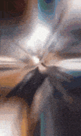 a close up of a metallic object with a blurred background