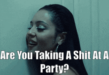 a woman is smiling with the words " are you taking a shit at a party " below her