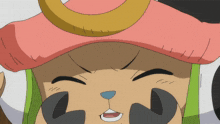 a close up of a cartoon character 's face with a pink hat on