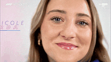 a close up of a woman 's face with nicole rd a written on the bottom