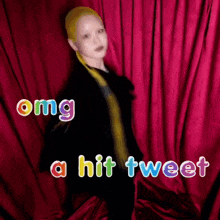 a woman with yellow hair stands in front of a red curtain with the words omg a hit tweet