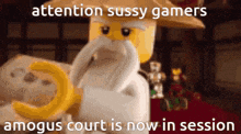 a lego figure with a beard and a hat says attention sussy gamers amagus court is now in session