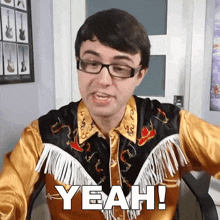 a man wearing glasses and a fringed shirt says yeah