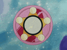 a pink and yellow circle with a star in the middle