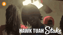 a hawk tuah stake advertisement with a man in a blue shirt