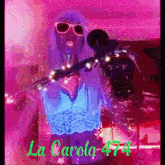 a woman singing into a microphone with the name la carola 474 written in green