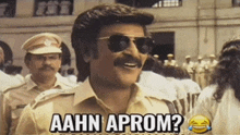 a man wearing sunglasses says aahn aprom