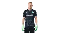 a man wearing a hofmann shirt and gloves