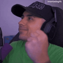 a man wearing headphones and a hat with miami written on it