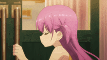 a girl with pink hair is standing in front of a green door