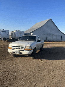 a white ford truck with a california license plate that says ywpzrn