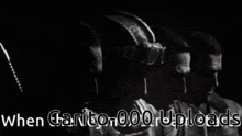 a black and white photo of four men with the words " when carito 000 uploads " on the bottom