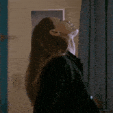 a woman in a black dress is looking up with the name lacystarriel below her