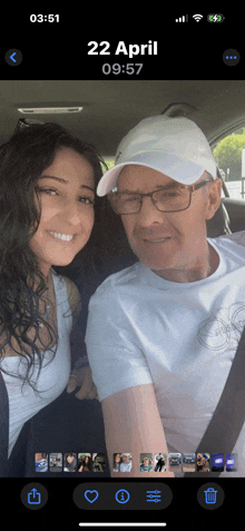a phone screen shows a picture of a man and woman on april 22nd