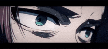 a close up of a person 's eyes with a serious look on their face .