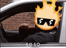 a police officer wearing sunglasses and a flaming head is driving a car