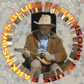 a man in a cowboy hat is playing a banjo surrounded by the words " arkinsons blues "