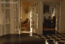 a woman in an apron walks through a living room and dining room with the hashtag #mrsmaiset