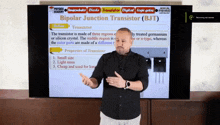 a man is giving a lecture about bipolar junction transistor ( bjt )