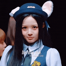 a girl wearing a cat ear hat says " before me "