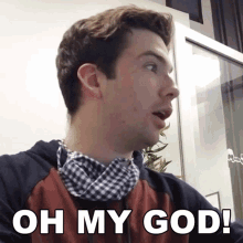 a man with a scarf around his neck and the words oh my god