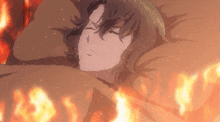 a man is laying on a bed with a fire behind him