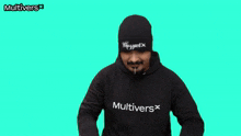 a man making a heart shape with his hands wearing a multivers hoodie