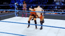 two women are wrestling in a wrestling ring with the words the next big thing on the bottom