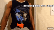 a man in a regular show shirt is holding a gun