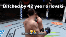 two men are fighting in a boxing ring with the words " bitched by 42 year arlovski " written above them