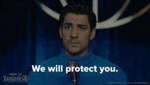 a man wearing a blue sweater and tie says we will protect you