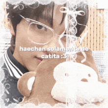 a picture of a boy with glasses holding a teddy bear with the words haechan solamente de catita : 3 on it