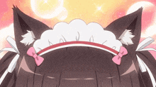 a close up of a cat 's ears with a bow