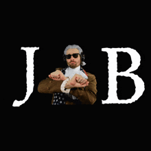 a man covering his face with his hands in front of the word jb