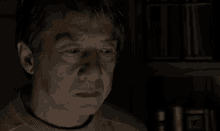 Jackie Chan The Foreigner GIF - Jackie Chan The Foreigner Sadly Looking At Photo GIFs