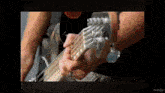 a man is playing a bass guitar in a video that says inshot at the bottom
