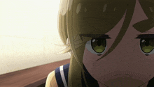 a close up of a cartoon character 's face with green eyes