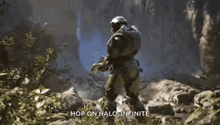 a video game character is holding a gun and says `` hop on halo : infinite ''