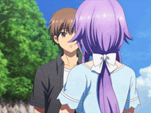 a boy and a girl are standing next to each other