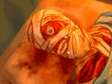 a cartoon drawing of a mummy with a huge eye