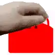 a close up of a person 's hand pressing a red button .