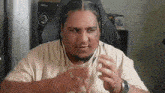 a man with braids is wearing headphones and a watch