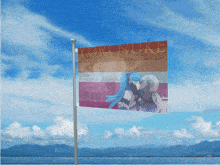 a yuri nuke flag is flying in the wind with mountains in the background