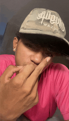 a man wearing a hat that says always waifu