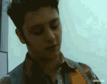 a close up of a man 's face with the words rbd.gif below