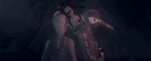 a group of people standing next to each other in a dark room