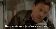 a man is talking on a cell phone and says `` non , mais non je n'vais pas crier . ''