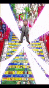 a man in a suit and tie stands on a set of stairs