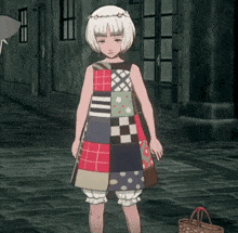 a girl in a patchwork dress is standing on a sidewalk next to a basket